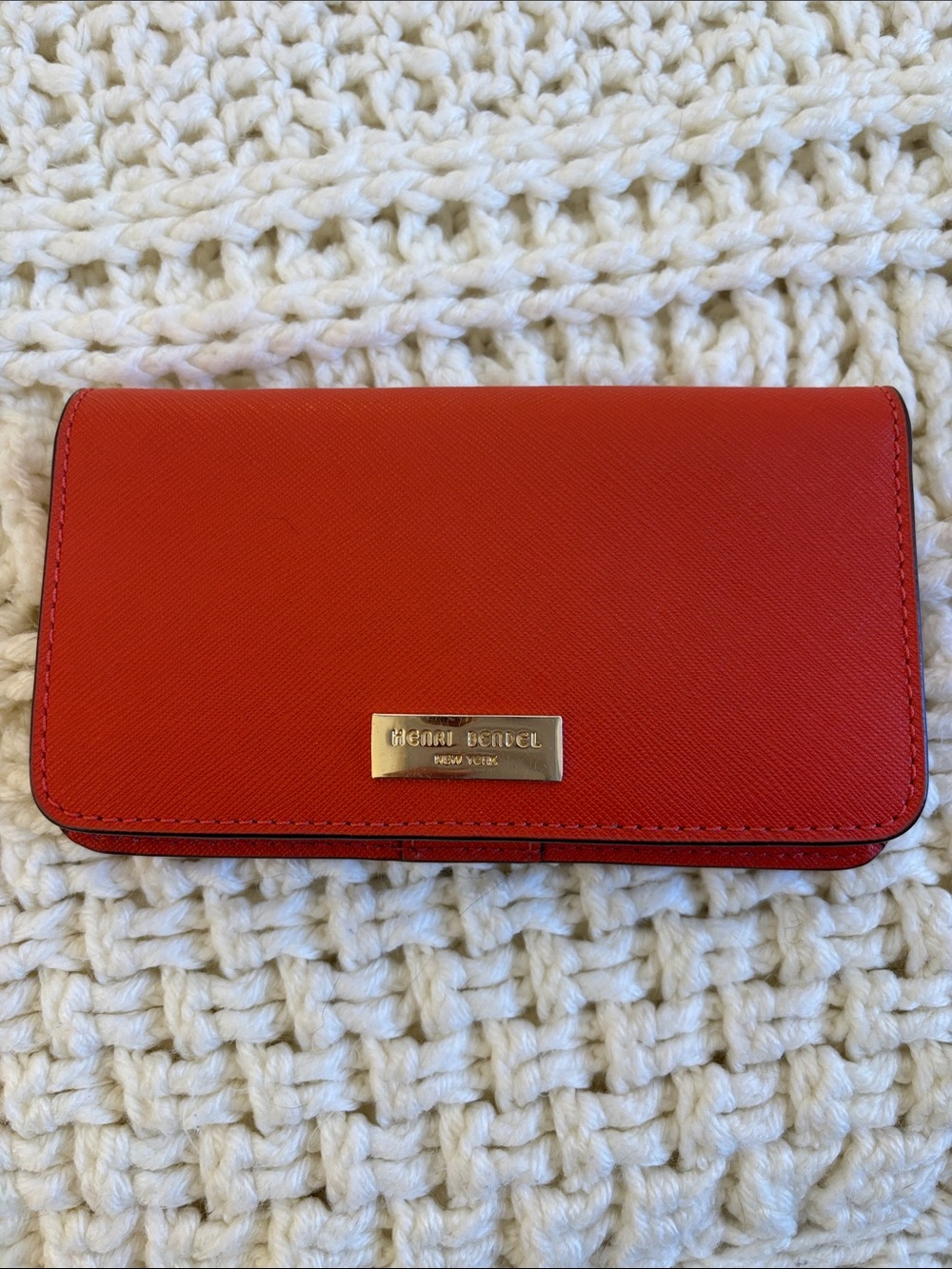henri bendel red saffiano leather continental phone wallet with gold plaque